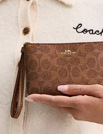 Coach Corner Zip Wristlet In Signature Canvas