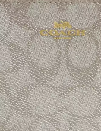 Coach Corner Zip Wristlet In Signature Canvas