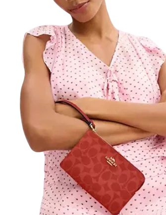Coach Corner Zip Wristlet In Signature Canvas