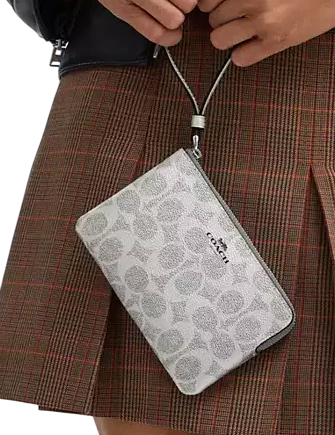 Coach Corner Zip Wristlet In Signature Canvas