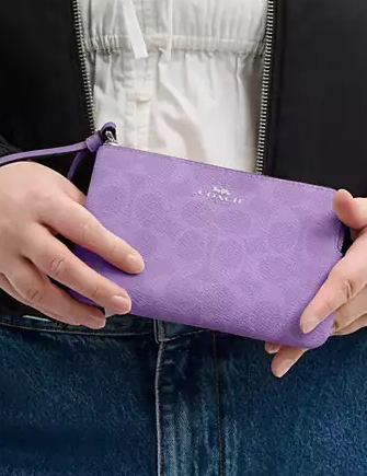 Coach Corner Zip Wristlet In Signature Canvas