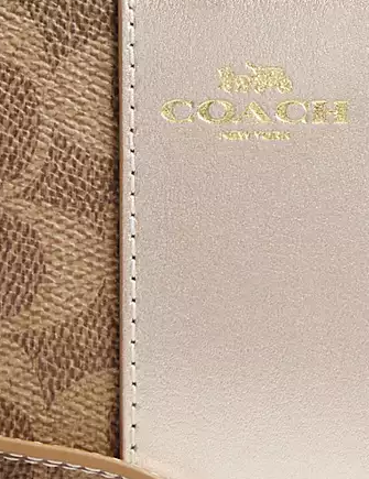 Coach Corner Zip Wristlet In Signature Canvas