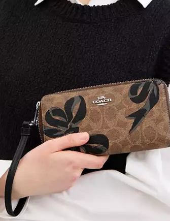 Coach Long Zip Around Wallet In Signature Canvas With Bow Print